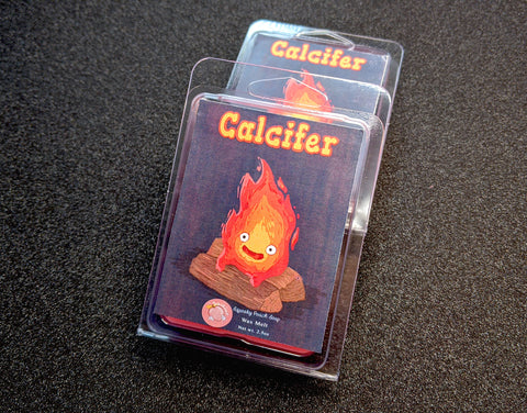 a wax melt label that pictures calcifer from howls moving castle. it reads "calcifer, wax melt, 3 ounces"