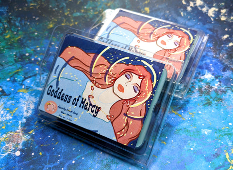 a wax melt label that pictures ponyo's mother from ponyo. it reads "goddess of mercy, wax melt, 3 ounces"
