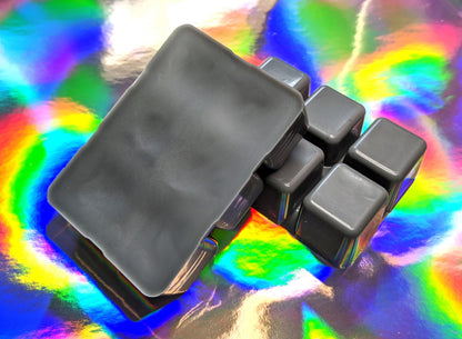 clamshell shaped wax that is colored black